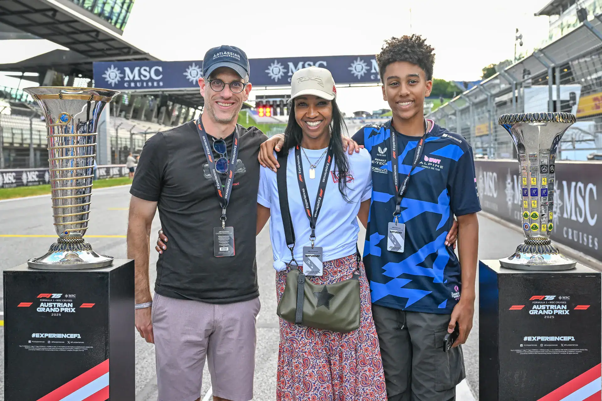 Guests on the grid at the Austrian Grand Prix Paddock Club between the trophies